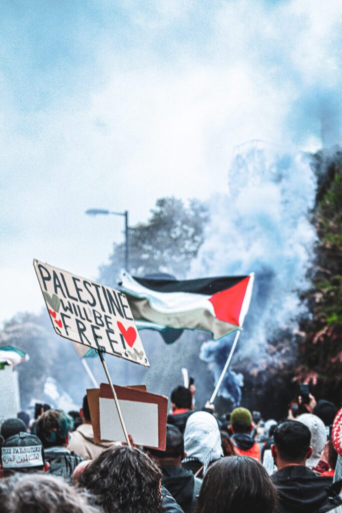 Pro Palestinian manifestation with gasbombs and 'Palestine will be free sign'